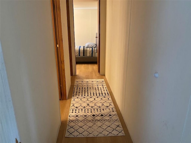 corridor featuring light hardwood / wood-style flooring