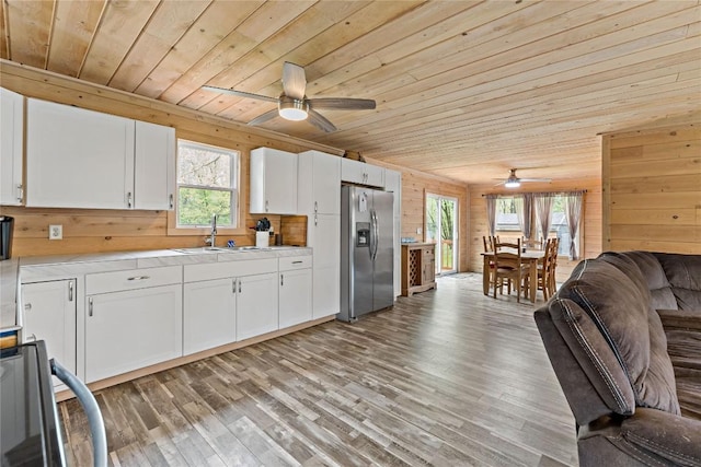 2629 River Dr, Jamestown, PA 16134 - kitchen featuring stainless steel fridge, wood ceiling, a ceiling fan, range, and open floor plan