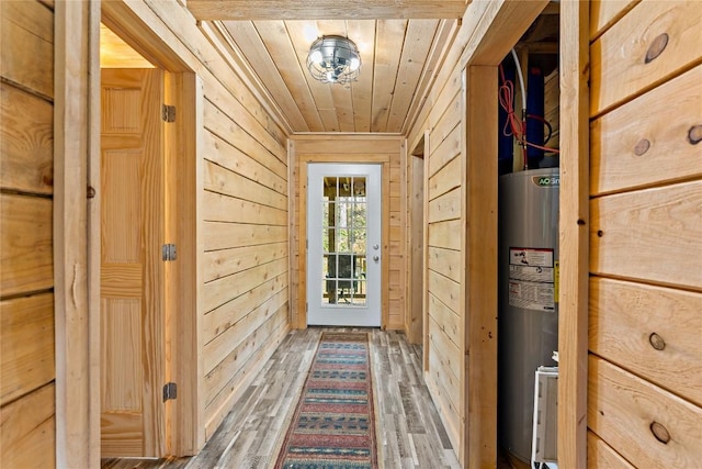 2629 River Dr, Jamestown, PA 16134 - entryway with water heater, wood walls, wooden ceiling, and wood finished floors