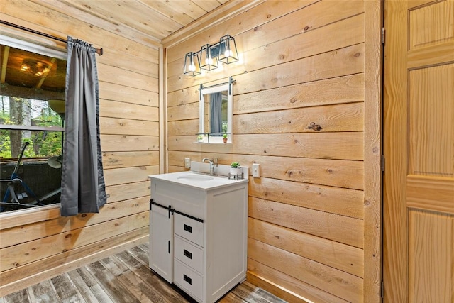 2629 River Dr, Jamestown, PA 16134 - bathroom with vanity, wooden walls, wood finished floors, and wooden ceiling