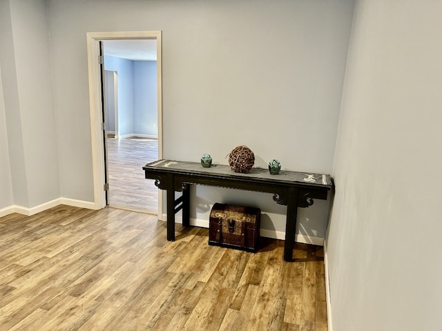 home office featuring light wood-type flooring and baseboards