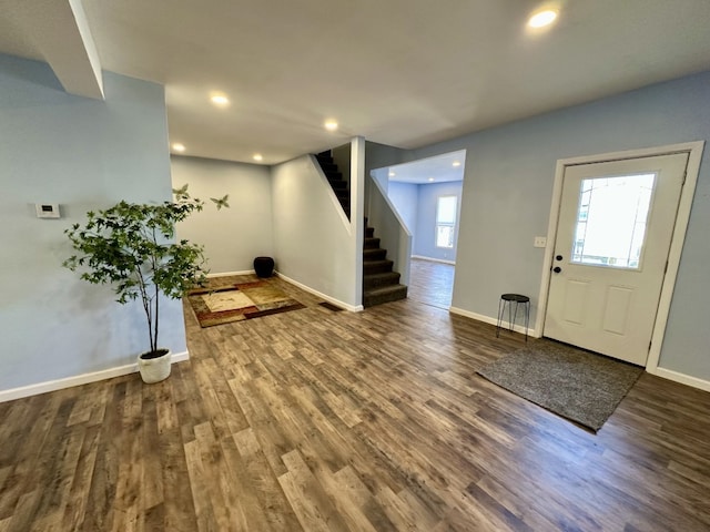 entrance foyer featuring recessed lighting, stairway, baseboards, and wood finished floors