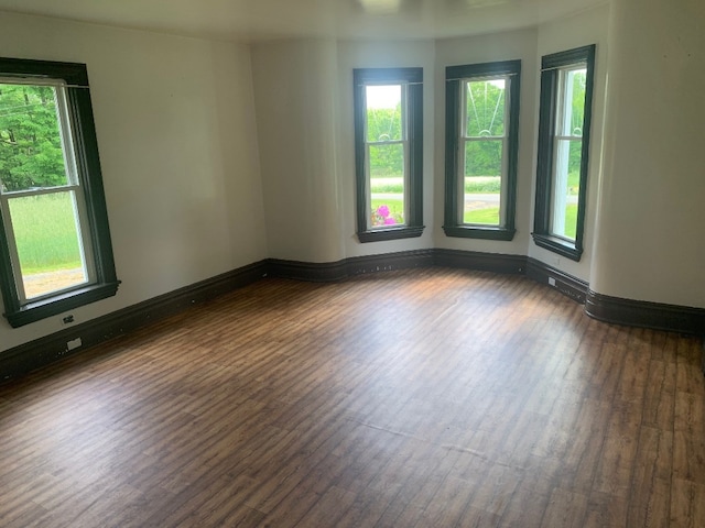 5511 Lake Rd, Atlantic, PA 16111 - unfurnished room featuring dark wood-type flooring, healthy amount of natural light, and baseboards