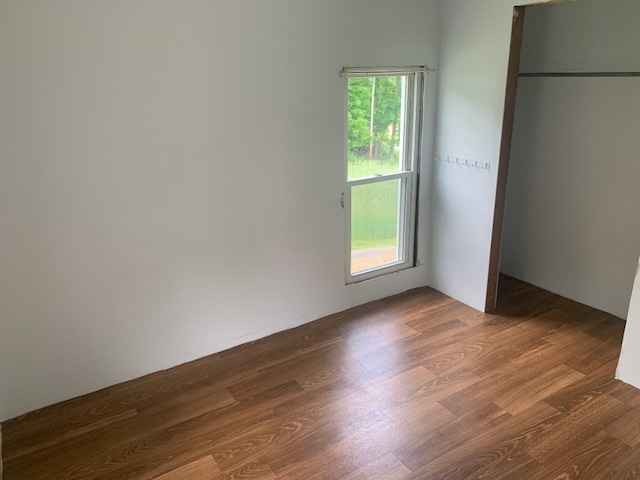 5511 Lake Rd, Atlantic, PA 16111 - unfurnished bedroom featuring dark wood-type flooring
