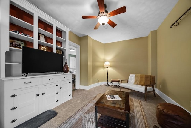 living room featuring ceiling fan and carpet floors