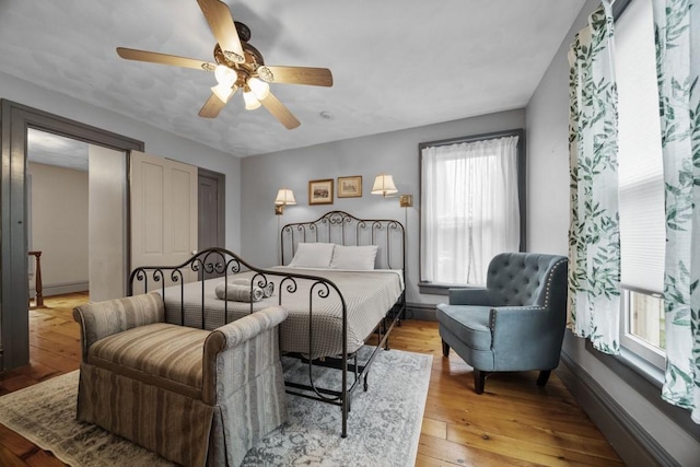 bedroom featuring ceiling fan and light hardwood / wood-style flooring