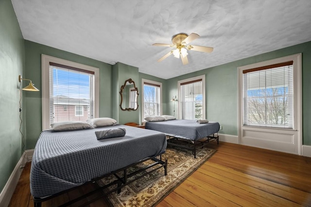 bedroom featuring ceiling fan and wood-type flooring