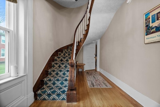 stairs with wood-type flooring