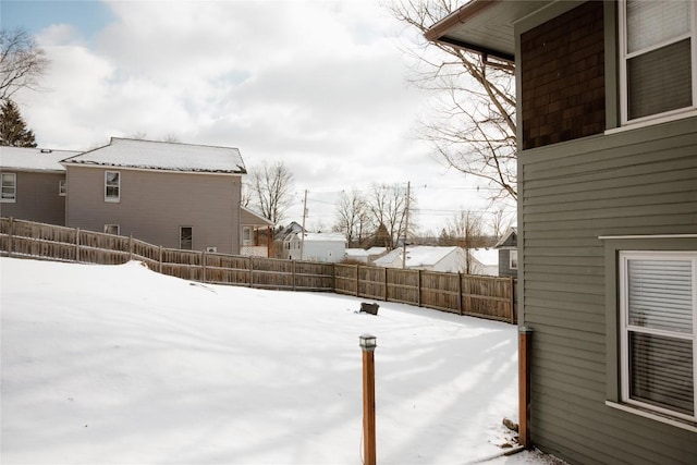 view of yard covered in snow