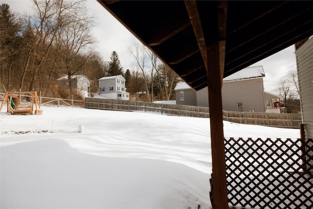 view of yard covered in snow