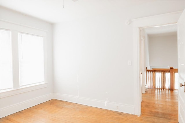 spare room with light hardwood / wood-style flooring