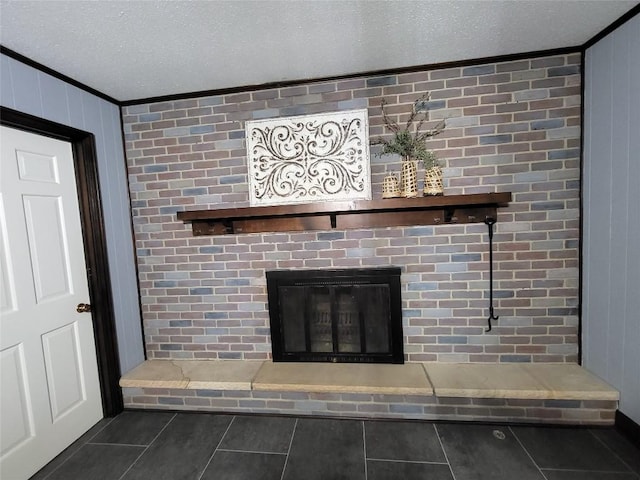 details featuring a fireplace, a textured ceiling, and ornamental molding