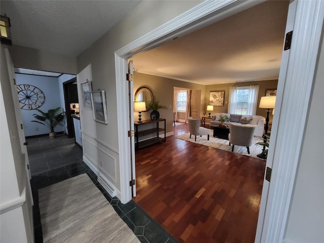 corridor featuring a textured ceiling