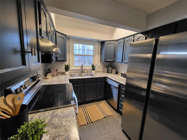 kitchen with light stone countertops, light tile patterned floors, stainless steel appliances, and sink