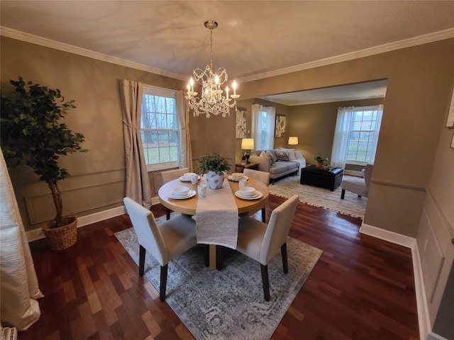 dining area with a notable chandelier, crown molding, and dark wood-type flooring