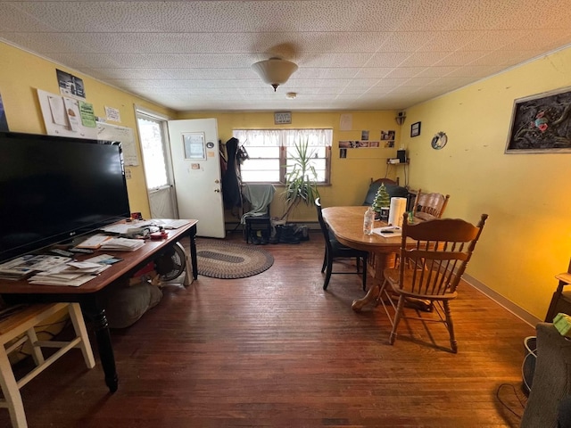 dining space with dark hardwood / wood-style floors