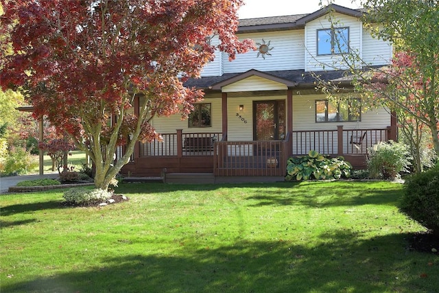 view of front facade featuring covered porch and a front yard