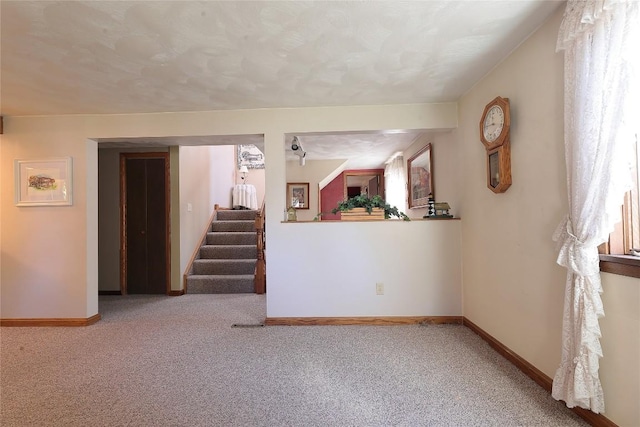 spare room with light colored carpet