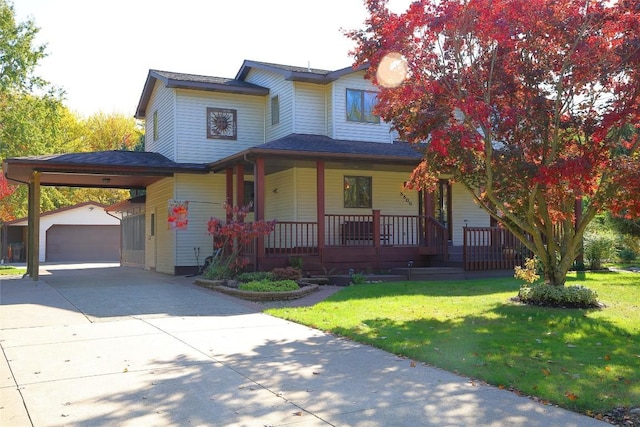 view of front of property with a garage, a front lawn, a carport, an outbuilding, and a porch