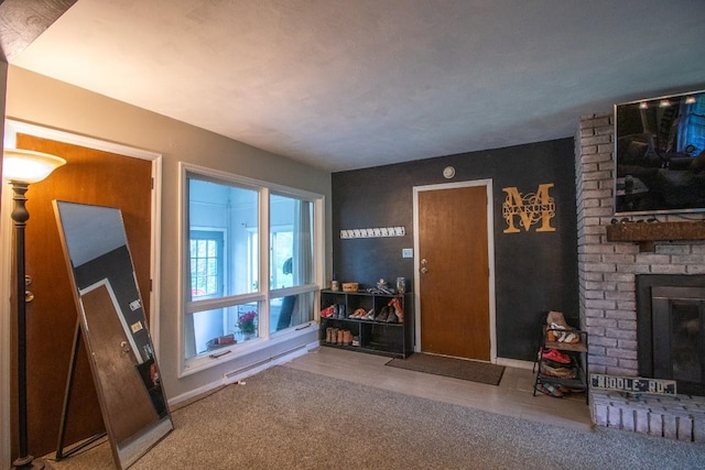 104 Hillcrest Dr, Edinboro, PA 16412 - living room featuring a brick fireplace, baseboard heating, and carpet floors