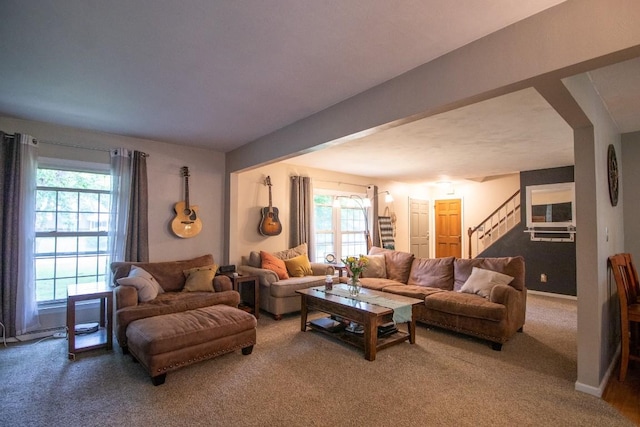 104 Hillcrest Dr, Edinboro, PA 16412 - carpeted living room with healthy amount of natural light and stairs