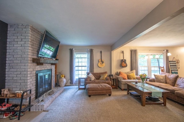 104 Hillcrest Dr, Edinboro, PA 16412 - carpeted living area featuring a brick fireplace