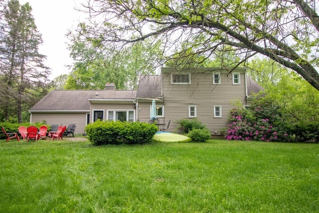 104 Hillcrest Dr, Edinboro, PA 16412 - back of property featuring a lawn and a chimney