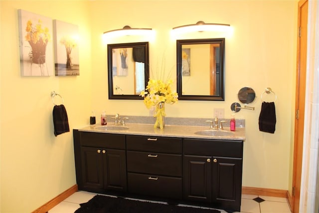 bathroom with tile patterned flooring and vanity