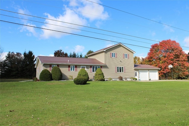 view of front of home featuring a garage and a front yard