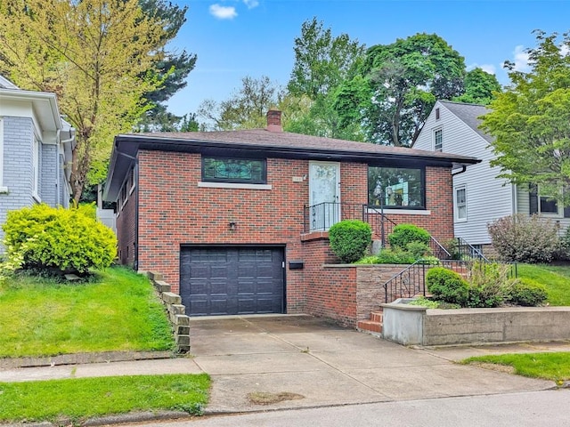 145 E 36th St, Erie, PA 16504 - view of front of property featuring brick siding, an attached garage, a chimney, and driveway