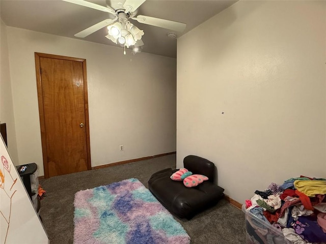 bedroom featuring ceiling fan and carpet