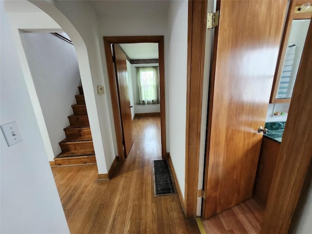 3829 Parade Blvd, Erie, PA 16504 - corridor with wood finished floors, stairway, arched walkways, and baseboards