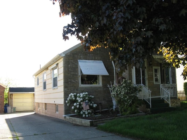 3829 Parade Blvd, Erie, PA 16504 - view of front of house with concrete driveway, a garage, and an outdoor structure
