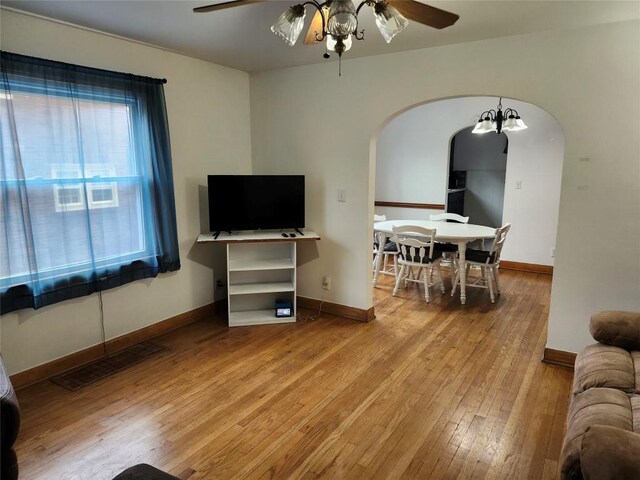 3829 Parade Blvd, Erie, PA 16504 - living room with arched walkways, a ceiling fan, hardwood / wood-style flooring, and baseboards
