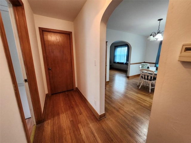 3829 Parade Blvd, Erie, PA 16504 - hallway featuring arched walkways, wood finished floors, and baseboards