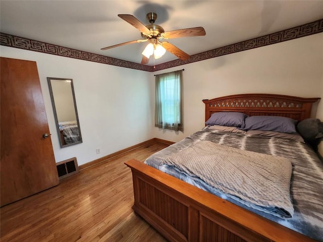 3829 Parade Blvd, Erie, PA 16504 - bedroom featuring wood finished floors, baseboards, and ceiling fan