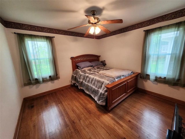 3829 Parade Blvd, Erie, PA 16504 - bedroom with dark wood-type flooring, baseboards, and ceiling fan