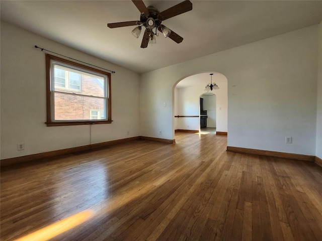 3829 Parade Blvd, Erie, PA 16504 - unfurnished room featuring arched walkways, hardwood / wood-style floors, and ceiling fan
