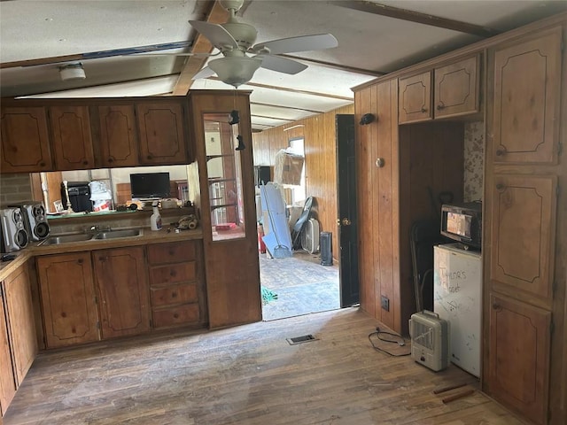 0 Hickory Dr, Espyville, PA 16424 - kitchen with ceiling fan, a sink, wood walls, light wood-type flooring, and visible vents