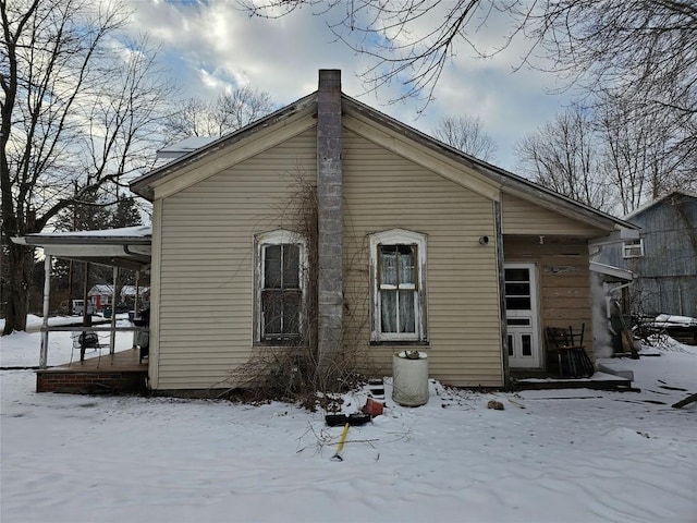 view of snow covered house