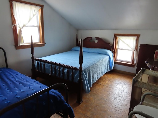 bedroom with lofted ceiling