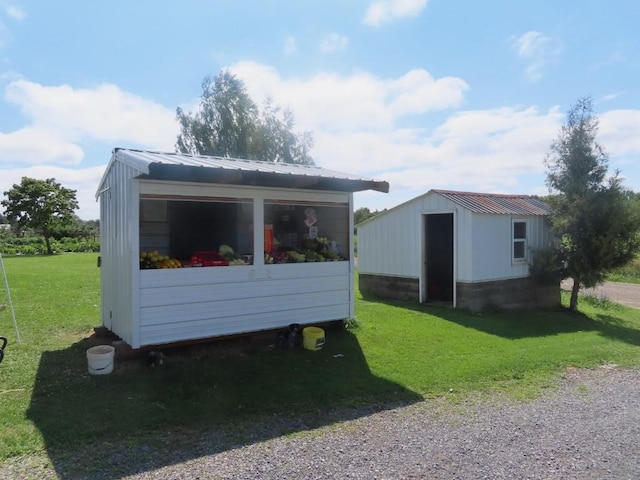 view of outbuilding with a lawn