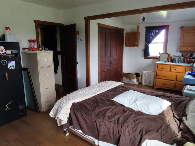 bedroom featuring dark wood-type flooring