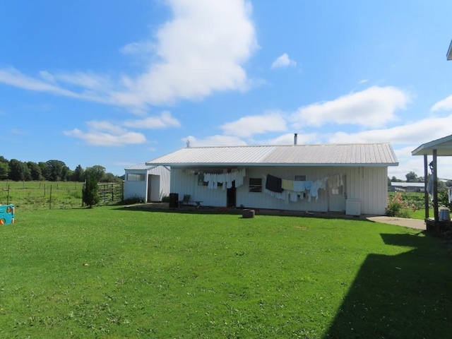 rear view of house with a lawn