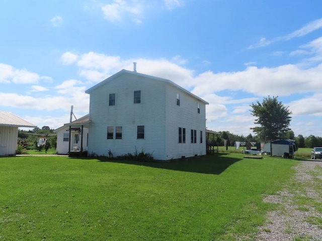 view of home's exterior featuring a yard