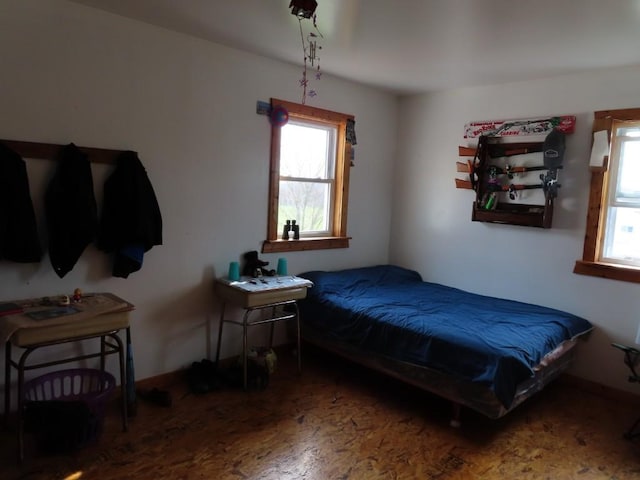 bedroom with hardwood / wood-style flooring