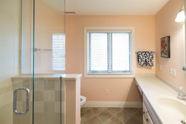 full bathroom featuring a stall shower, plenty of natural light, vanity, and tile patterned floors