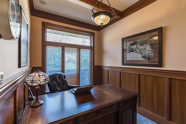 office area featuring ornamental molding and a wainscoted wall