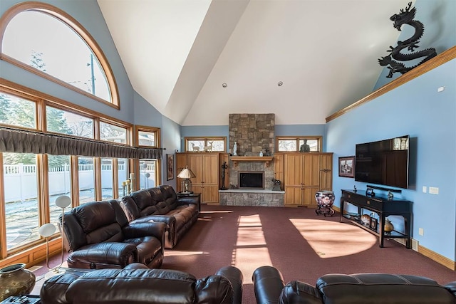 living room with carpet floors, baseboards, a fireplace, and high vaulted ceiling