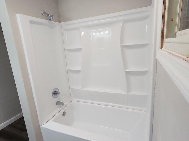 bathroom featuring  shower combination